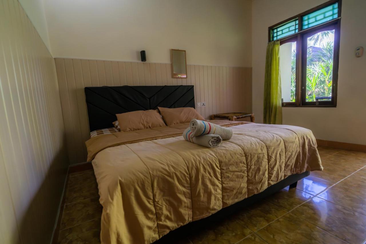 Family Garden Homestay Сенггиги Экстерьер фото